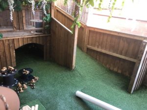 The Beanie Room outdoor area is situated to the side of the building. There is a large crawl space, ramp and den for the babies to explore and develop their movement safely.