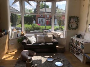 The front room has boasts a large bay window which allows natural light to flood in. There is also a cosy couch for parents to use to get the babies settled and ready to leave, as well as offering comfort for bottle feedings.